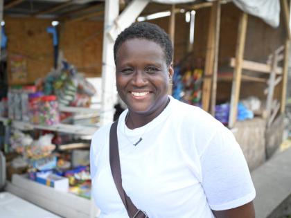 Melessa Hamilton of Pear Tree River expresses gratitude for the new shed at the Hope Road Transportation Centre in Morant Bay.