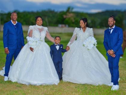 Ring bearer Romeish (centre) is joined by his parents, Henry (right) and Dianne Johnson (second right), and Gary (left) and Keisha Cooper (second left).
