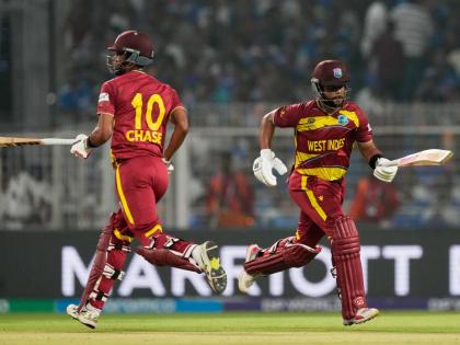 West Indies’ captain Shai Hope (right) and batting partner Roston Chase run between the wickets during the T20 World Cup cricket match against India in Kolkata, India, on Sunday.