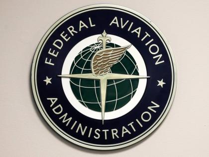 A Federal Aviation Administration sign hangs in the tower at John F. Kennedy International Airport in New York, March 16, 2017. (AP Photo/Seth Wenig, File)