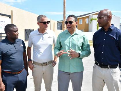 WIHCON CEO Marvin Campbell (left) and ICD CEO Peter Melhado with Prime Minister Dr Andrew Holness (second right) and Dr Alfred Dawes, member of parliament for St Catherine South East, during yesterday’s launch of the Chester Creek housing development in 