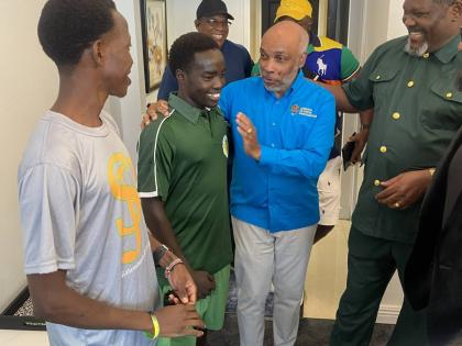St Jago High’s Kenyan athletes Ryan Achau (left) and Methuselah Kimutai meet with Jamaica Olympic Association president Christopher Samuda (second right) and National Olympic Committee of Kenya president Shadrack Maluki (right) at The Jamaica Pegasus Hot