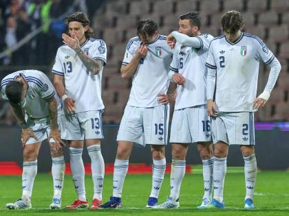 Italy’s players react during a penalty shoot-out during the World Cup qualifying playoff final football match against Bosnia and Italy in Zenica, Bosnia, yesterday.