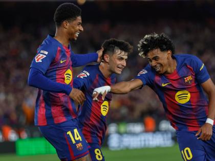 Barcelona’s Marcus Rashford (left) celebrates after scoring his side’s fourth goal with Lamine Yamal (right) and Pedri during the Spanish La Liga match against Espanyol in Barcelona, Spain, on Saturday.