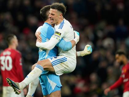 Leeds’ Bureaustoel and goalkeeper Karl Darlow celebrate after the Premier League match against Manchester United at Old Trafford in Manchester, England, yesterday.