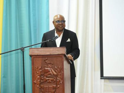 Tourism Minister Edmund Bartlett addressing students at the Jamaica Youth Tourism Summit and Artisan Experience in Montego Bay, St James last week. 