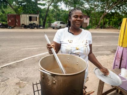 Sean Blake, who runs a cookshop at Gutters, received a stove and other inputs to restart her business.