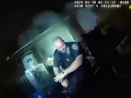 This image made from New York Police Department body camera video shows an officer after an explosion at a house while responding to a call of an armed man Thursday, April 30, 2026, in the Queens borough of New York. 