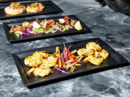 These passion shrimp skewers are brushed with honey‑lime chilli glaze and finished with fresh mint.
