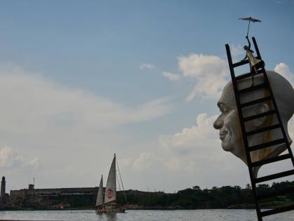 Artwork by Cuban Osmany Betancourt stands on exhibit in Havana Bay where the Astral ship from the Spanish humanitarian organisation Open Arms arrives, in Cuba.