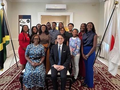 Sheila Sealy Monteith (left), permanent secretary at the Ministry of Foreign Affairs and Foreign Trade, with Ambassador of Japan to Jamaica, Kohei Maruyama, pose for a photograph of the 2026 cohort of JET programme at a send-off reception on Thursday, July