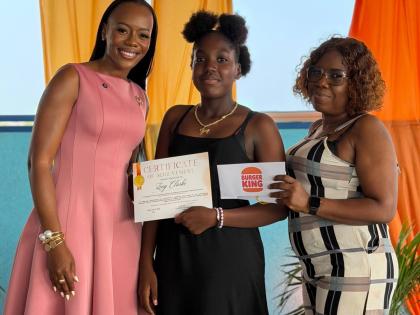 Councillor Waynette Strachan Nelson (left) shares a proud moment with Zoey Clarke (centre), a Hagley Park PEP High Achiever, joined by her mother, Angela Radcliffe, during the inaugural Hagley Park PEP High Achievers Luncheon at the JACDEN Medical Rooftop 