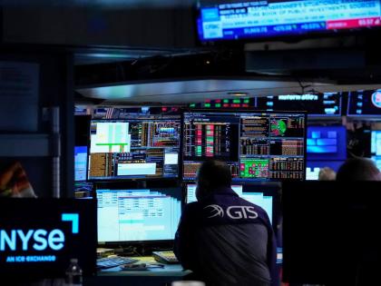 Specialist Dilip Patel working on the floor of the New York Stock Exchange on Thursday, July 30 in New York.  AP 