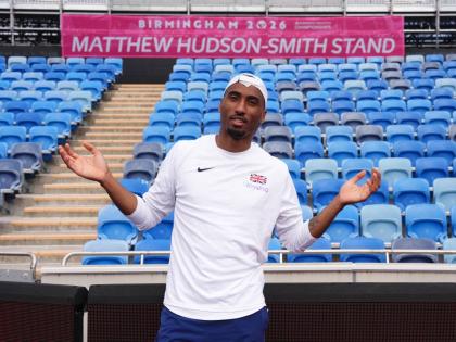 Britain’s Matthew Hudson-Smith poses in front of a stand named after him, during a training session ahead of the start of the European Athletics Championships, in Birmingham, England, yesterday.