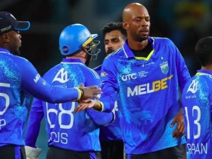 St Lucia captain Roston Chase celebrates with teammates after victory over the Antigua & Barbuda Falcons in the Republic Bank Caribbean Premier League last week.