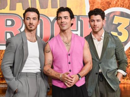 The Jonas Brothers (from left) Kevin Jonas, Joe Jonas, and Nick Jonas arrive at the premiere of ‘Camp Rock 3’ on Monday, August 10, at The Walt Disney Studios in Burbank, California. 