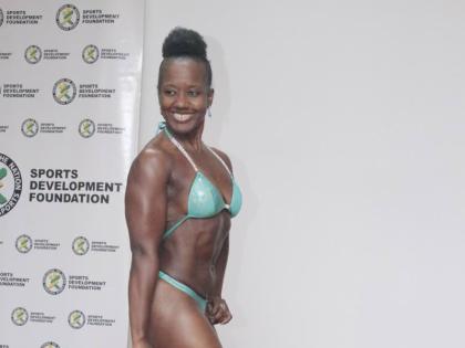 Athlete and Event Coordinator Malene Carr strikes a side pose during a live category demonstration at the official press launch for the 2026 Mayberry JABBFA National Senior Championship at The Liguanea Club recently. 