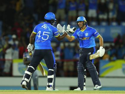 
Joshua Bishop (left) and Shadley van Schalkwyk of St Lucia Kings celebrate victory during the Republic Bank Caribbean Premier League T20 match against the Antigua and Barbuda Falcons in Gros Islet, St Lucia, on Friday night. 