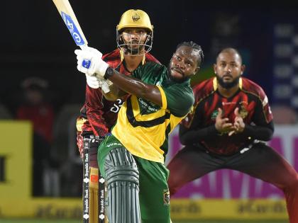 Kirk McKenzie hits a six during his innings of 69 for the Jamaica Kingsmen against the Trinbago Knight Riders at Sabina Park on Saturday night.