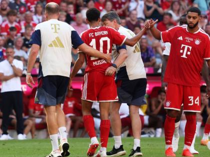 Munich's Jamal Musiala (center) leaves the pitch due to an injury during a pre-season soccer match between FC Bayern Munich and RB Leipzig in Munich, Germany, on Saturday. - AP photo