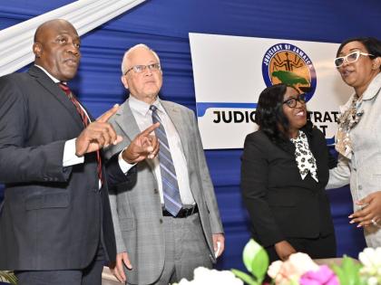 Delroy Chuck (second left), minister of justice and constitutional affairs, speaks with (from left) Chief Justice Bryan Sykes; Tricia Cameron-Anglin, director/ CEO of Court Administration Division; and Justice Simone Wolfe Reece, senior puisne judge of the