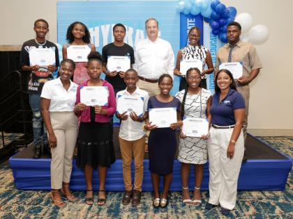 Wisynco Group representatives Francois Chalifour (top row, third right), director, marketing and information technology; Jusanna Staple (front row, left), brand coordinator, WATA Portfolio; and Brittany Thwaites (front row, right), brand manager, WATA Port