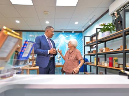 Prime Minister Dr Andrew Holness (left), in conversation with Sister Grace Yap, Order of St. Francis (OSF), in the gift shop of the newly opened Alpha Mercy Historical Centre. 