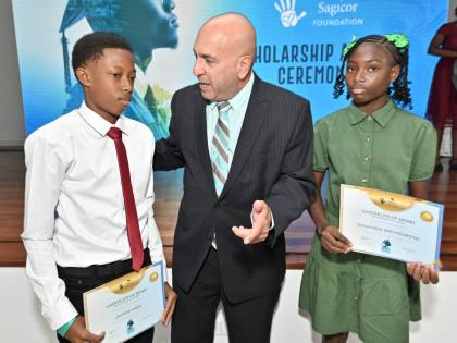 Christopher Zacca, president and CEO of Sagicor Group Jamaica and chairman of Sagicor Foundation, speaks with JTA/Sagicor National Athletics Championships, Jahmar Amos, 2026 Champion Boy and Travaneek Breakenridge, 2026 Championship Girl at the Sagicor Fou