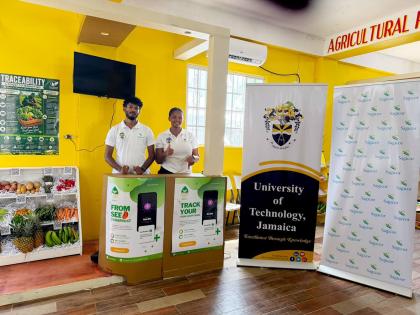 Students Dimetri Lee (left) and Serena Morris of UTech, Jamaica’s Sagicor Innovation Lab, showcase the RootIQ platform at the annual Denbigh Agricultural, Industrial and Food Show.