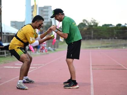 Nate McPeak (left), goalkeeper for the Jamaica Lacrosse team, goes through reflex conditioning ahead of the match against the United States in the Pan American Lacrosse Championships on Wednesday.