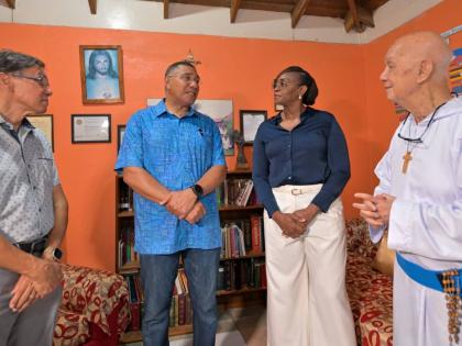 Prime Minister, Dr Andrew Holness (second left), in discussion with Founder of the Missionaries of the Poor, Father Richard Ho Lung (right), during a visit to the Missionaries of the Poor Hanover Street location in downtown Kingston on Wednesday (August 19