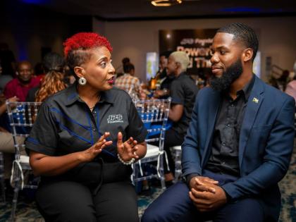 Head of the JPS Foundation Sophia Lewis (left) in conversation with Paul Thomas Watson, one of the Foundation’s six Power Up East-West Power Grant recipients at a recent awards ceremony at The Jamaica Pegasus hotel in New Kingston. Watson was awarded a s