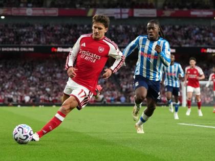 Arsenal’s Christos Tzolis runs with the ball followed by Coventry City’s Brandon Thomas-Asante during the English Premier League  match between Arsenal and Coventry City in London yesterday.