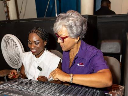 Kim Mair (right), CEO of the JMMB Joan Duncan Foundation, takes a first-hand look at Little Theatre’s new Digital Sound Board System, with her is Marisa Benain, executive director of the Little Theatre. 