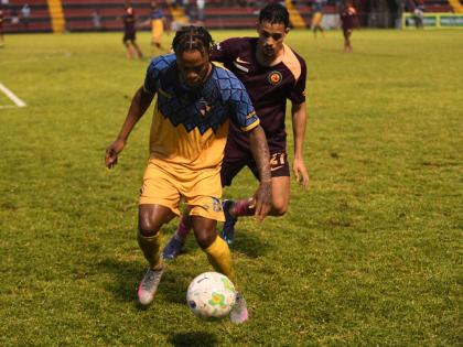 Mikyle Williams (left) of Racing United controls the ball as Marcos Filho of Chapelton Maroon moves in to tackle during a Jamaica Premier League match at the Anthony Spaulding Sports Complex last season.