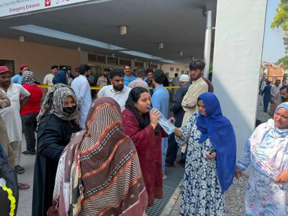 Relatives of the children who died in a hospital fire gather at the hospital in Islamabad, Pakistan, on Wednesday. - AP photo