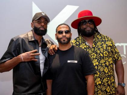 BZR WKND promoters Ryan Burke (left) and Gramps Morgan (right) flank Kelvin Santiago during the August BZR WKND launch. 