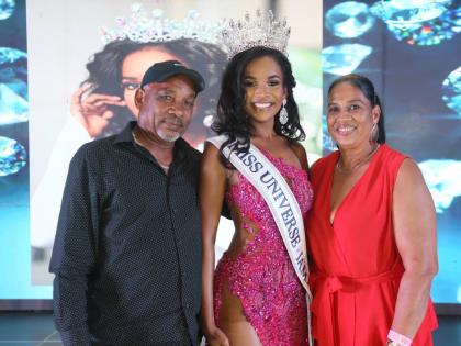 Proud parents Victor and Sonia Hall join their daughter, Celene, following her crowning as Miss Universe Jamaica 2026 at AC Hotel Kingston on Sunday. 