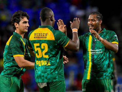 Jamaica Kingsmen players (from left) Hunain Shah, skipper Rovman Powell and Keemo Paul celebrate the fall of a wicket during the Caribbean Premier League T20 cricket match against St. Kitts and Nevis Patriots at Warner Park, St. Kitts on Thursday, August 2