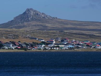 Mount Tumbledown stands tall behind Stanley on the Falkland Islands, also known as Islas Malvinas, March.