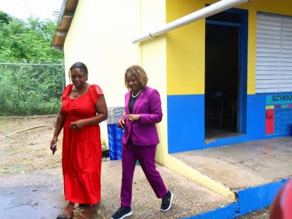 Minister of Education, Skills, Youth and Information, Senator Dr Dana Morris Dixon (right), tours the Ferris Primary School in Westmoreland with the principal of the institution, Tracie Campbell, on Wednesday, September 2.