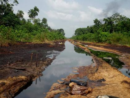 FILE - An oil spill is visible within the Niger Delta in Ogboinbiri, Nigeria, on Dec. 11, 2024. (AP Photo/Sunday Alamba)