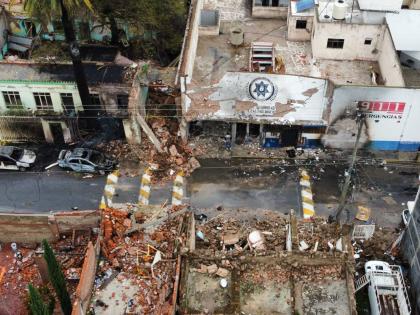 A municipal police station (top) and other buildings are damaged after a car bomb exploded the previous night in Ojocaliente, Zacatecas state, Mexico, last Monday.