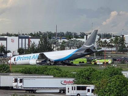 An Amazon cargo plane sits at the Miami International Airport (MIA) after it overshot the runway, Sunday, Sept. 6, 2026. (AP Photo/David Fischer)