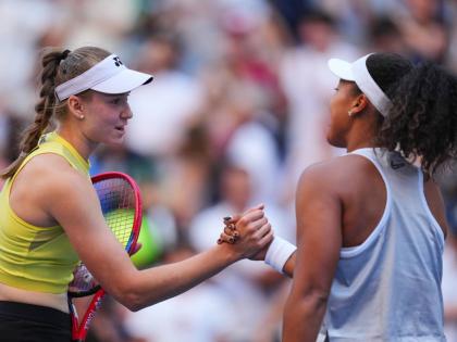 Elena Rybakina, of Kazakhstan (left) greets Naomi Osaka, of Japan, after winning a match during the fourth round of the US Open tennis championships yesterday.