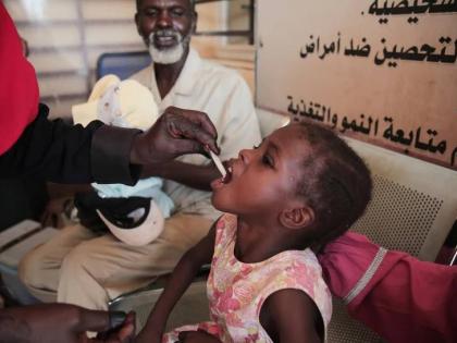 A Sudanese girl receives an oral cholera vaccine during a vaccination campaign conducted by health ministry workers in Khartoum, Sudan, on August 13, 2025. 