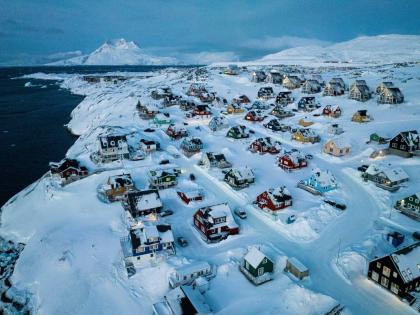 Houses covered in snow on the coast of a sea inlet of Nuuk, Greenland. - AP photo