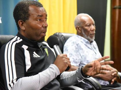 Rudolph Speid (left), the interim head coach for the  Reggae Boyz, announces the Nations League squad at the Jamaica Football Federation’s head office in New Kingston yesterday.  Looking on is Barry Watson  vice president of the JFF and chairman of the f