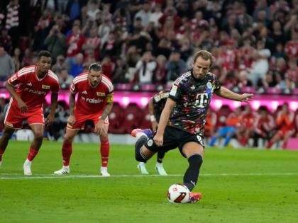  Bayern’s Harry Kane scores his side’s second goal  from the penalty spot during the Bundesliga match between Bayern Munich and Union Berlin in Munich, Germany yesterday.
