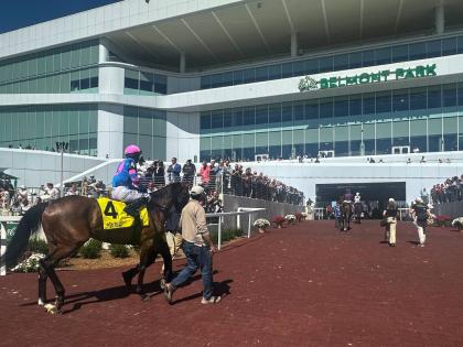 AP 
In this photo made with a smartphone, jockeys ride their horses into the newly-opened Belmont Park in Elmont, New York, on Friday.